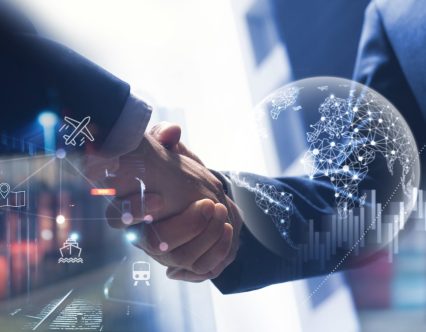 Smart logistics, Global business concept. Businessman making handshake for successful business, investment deal teamwork and partnership business partners on logistic global network distribution and supply chain